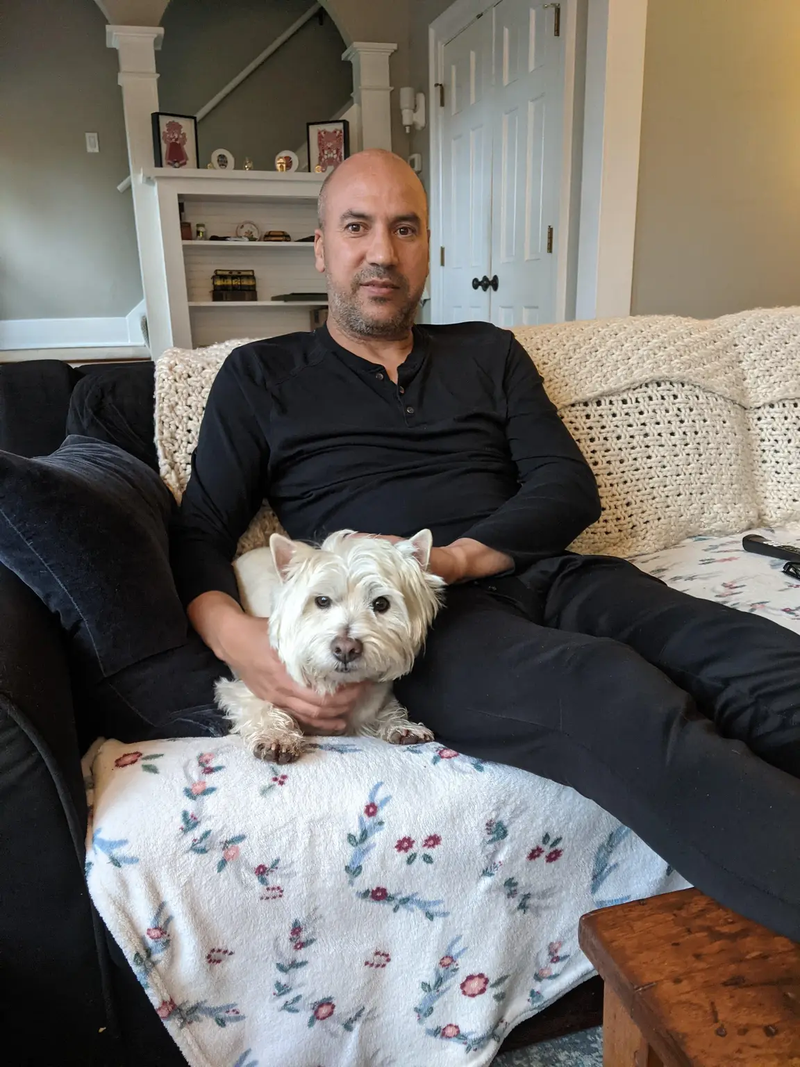 Rachid with white fluffy dog